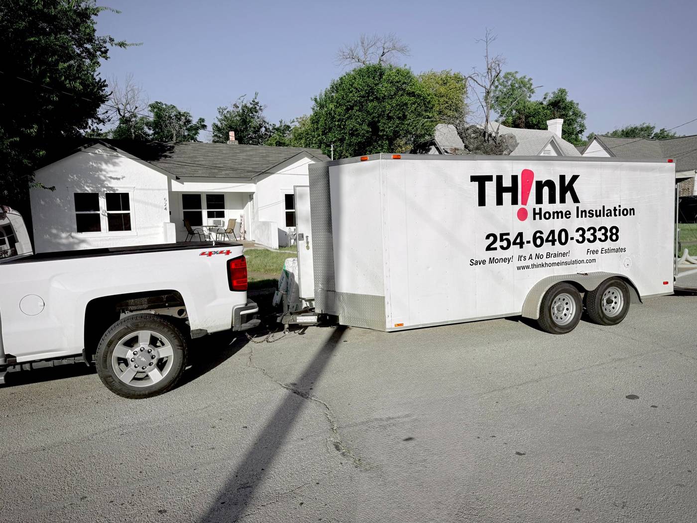Think Home Solutions truck and trailer at a job in Central Texas, with the TH!nK Home Insulation logo and phone number (254) 640-3338
